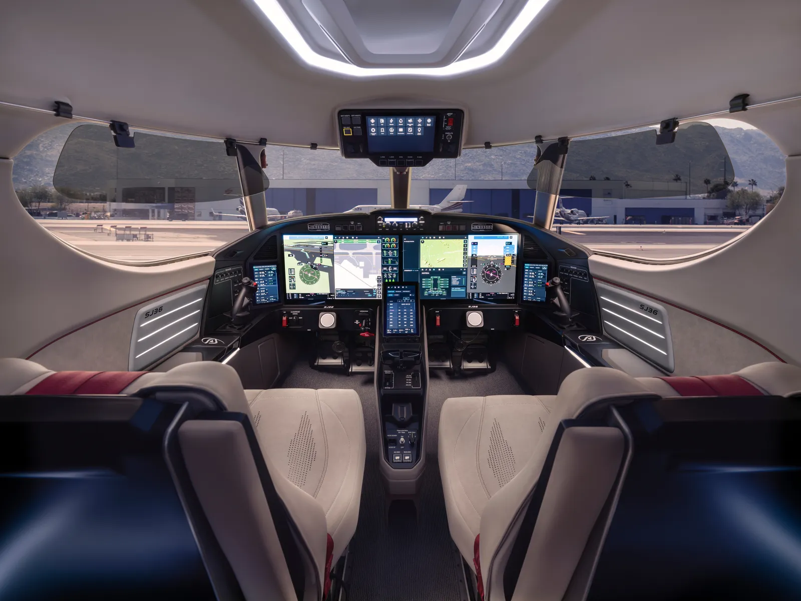 SyberJet SJ36 flight deck with SyberVision avionics on large displays and two light-colored seats